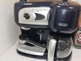 a coffee maker sitting on a counter in a kitchen
