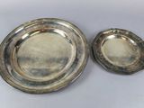 pair of silverplated serving dishes on a white background