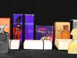 many different types of perfume bottles on a table