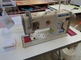 a sewing machine sitting on a table in a room