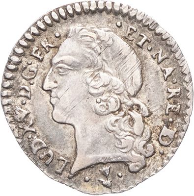 une pièce d'argent portant une tête de femme et une couronne