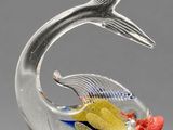 an image of a glass fish figurine with a fish tail