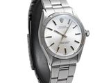 a close up of a watch on a white background with a white background