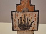 a small piece of wood with a picture of a castle on it