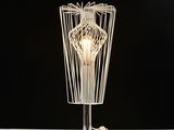 a lamp that is on a table with a black background