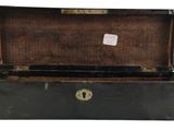 an old black suitcase with a tag on it