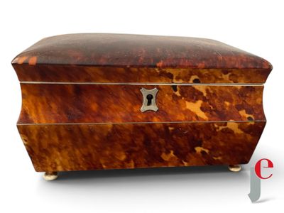 a small wooden box with a lock on it