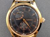 an image of a close up of a wrist watch on a table