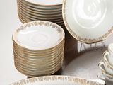 a lot of plates that are sitting on a table