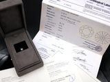a box with a ring inside of it on a table