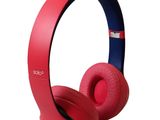 the beats on ear headphones are red and blue