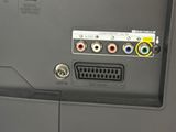 a close up view of a tv with multiple cables