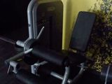 a gym room with a bench, weights, and other equipment
