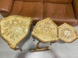 three pieces of furniture sitting on the floor next to a couch