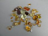 a lot of different colored stones on the table
