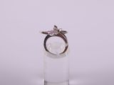 a close up of a silver ring with a star on it