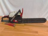 a chainsaw that is sitting on a wooden table