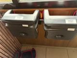 two suitcases sitting next to each other on the floor