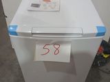 an image of a white refrigerator with a price tag on it
