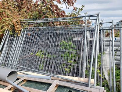 a metal fence that has been placed on top of a building