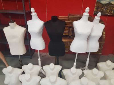 many mannequins on display in a room