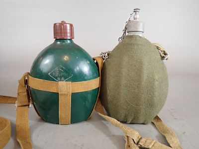 two canteens sitting next to each other on a table
