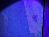 a blue light that is shining on a wall