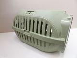 an image of a cat carrier on a white table