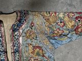 an image of a blue and gold jacket with birds on it