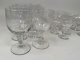 a lot of empty wine glasses on a table