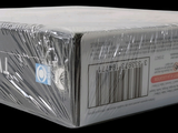 a box of apple products wrapped in plastic on a black background