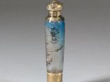 an image of a glass bottle with a bird on it