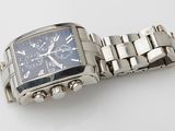 an image of a wrist watch on a white surface with a white background