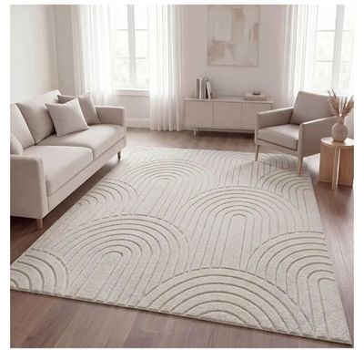 a white rug with waves on it in a living room