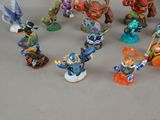 many figurines of different types and colors on the table