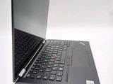 a laptop that is open on a white surface