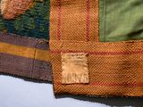 a close up of a piece of cloth with a tag on it