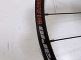 a close up of a bicycle wheel with a sticker on it