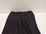 a close up of a pair of black pants on a white surface
