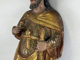 a statue of a man with a beard and a gold robe