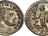 a silver coin with an image of a man on it