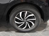 a close up of a car ' s wheel on the ground