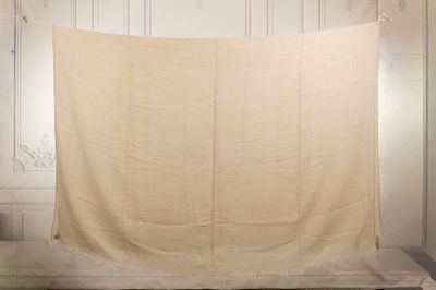 a white cloth hanging on a wall in a room