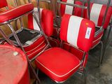 several red and white chairs are lined up in a room