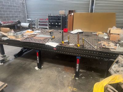 a workbench that has a lot of tools on it