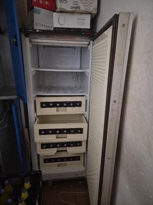 a refrigerator that has a lot of drawers inside of it