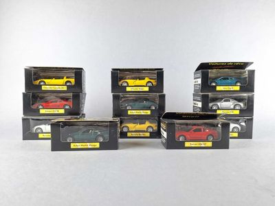 six different models of cars in boxes on a white surface