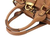 brown leather handbag on white background with gold hardwared handles