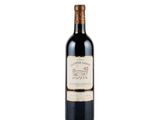 a bottle of wine sitting on top of a white surface