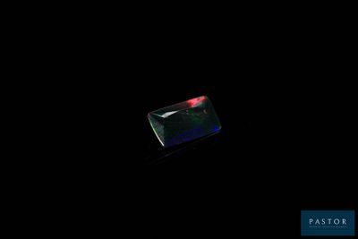 a black background with a red light in the middle of it